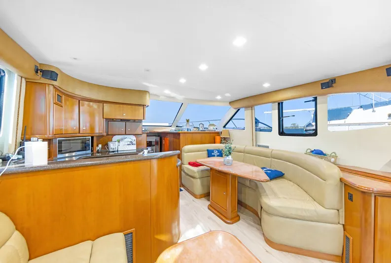 El Matador Yacht Photos Pics Luxurious interior of a 2007 Silverton 45 Convertible yacht with elegant wood finishes.