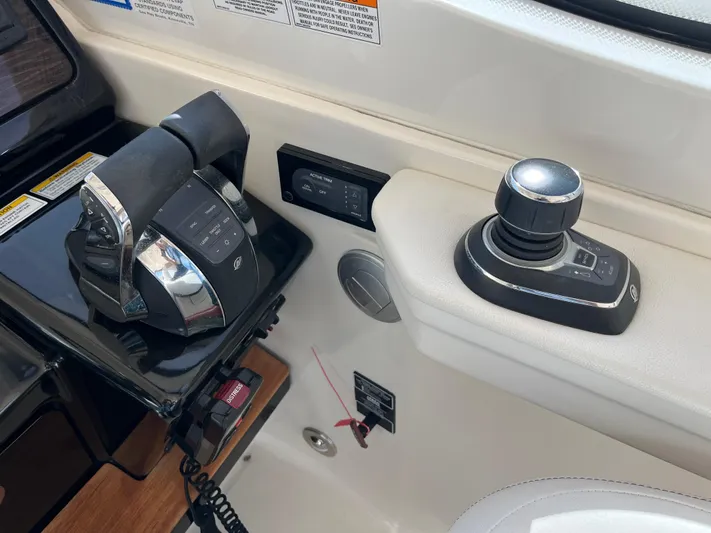  Yacht Photos Pics Control panel of 2018 Sea Ray Sundancer 350 boat with throttle and joystick.