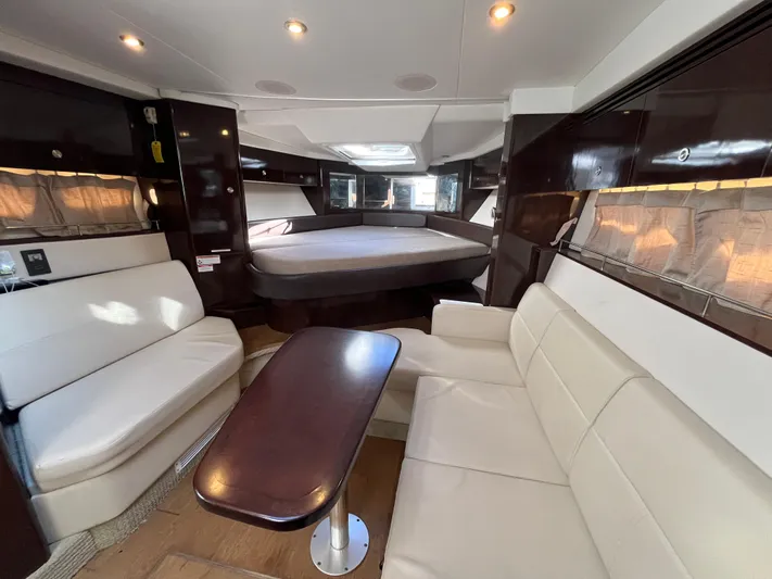  Yacht Photos Pics Interior of 2018 Sea Ray Sundancer 350 yacht with elegant seating and table.