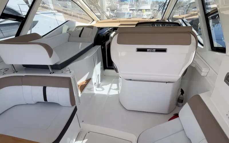  Yacht Photos Pics 2018 Sea Ray Sundancer 350 interior with modern seating and helm, showcasing luxury design.