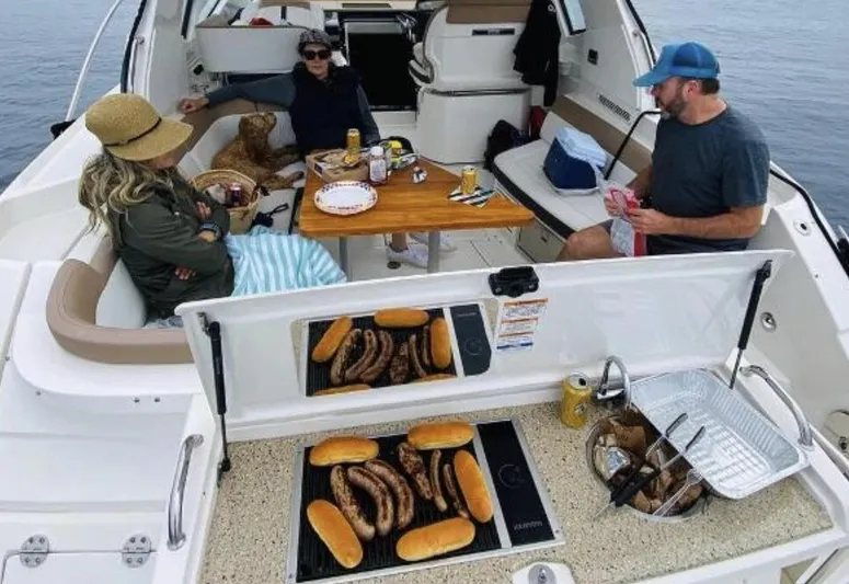  Yacht Photos Pics People enjoying a meal on a 2018 Sea Ray Sundancer 350 boat.