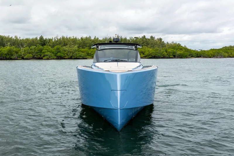 Exit Strategy Yacht Photos Pics 2023 Pardo Yachts 50 in blue, cruising on a calm waterway.