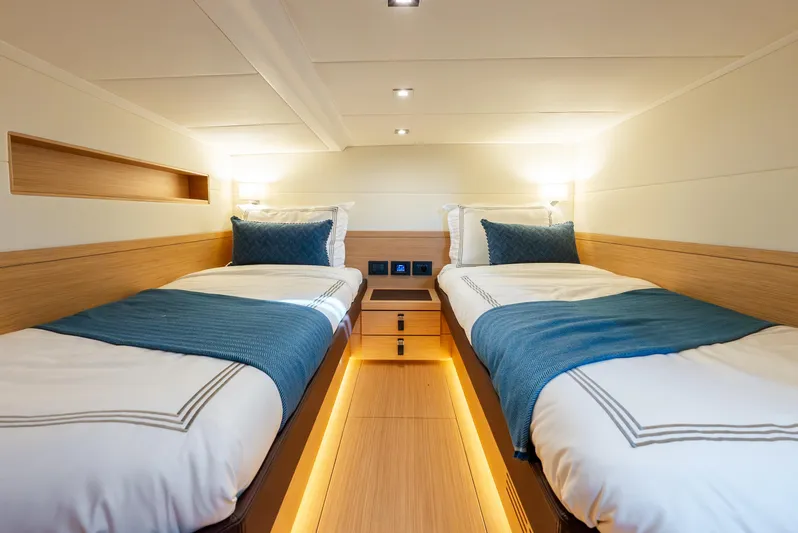 Exit Strategy Yacht Photos Pics Luxurious twin cabin in 2023 Pardo Yachts 50, featuring modern design and ambient lighting.