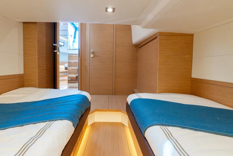 Exit Strategy Yacht Photos Pics Luxurious 2023 Pardo Yachts 50 cabin with twin beds and modern wood finish.