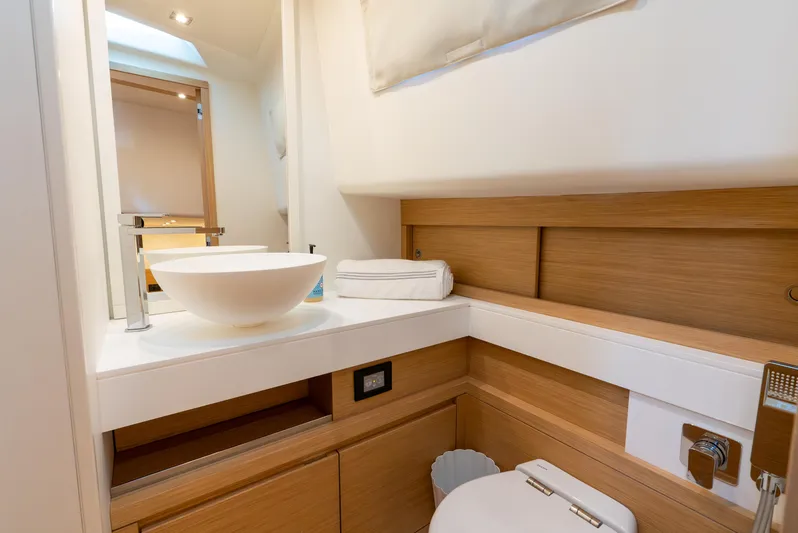 Exit Strategy Yacht Photos Pics Luxurious bathroom interior of 2023 Pardo Yachts 50, featuring modern sink and wooden accents.