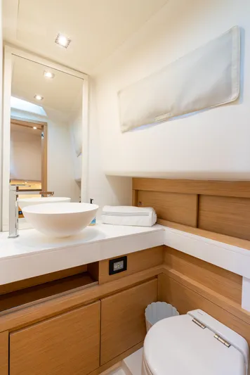Exit Strategy Yacht Photos Pics Luxurious bathroom in 2023 Pardo Yachts 50, featuring modern fixtures and elegant wood accents.