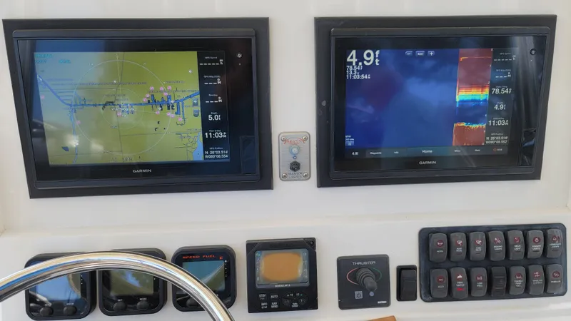 Every Effort Yacht Photos Pics 2008 Jupiter 34 FS boat dashboard with navigation and sonar screens.