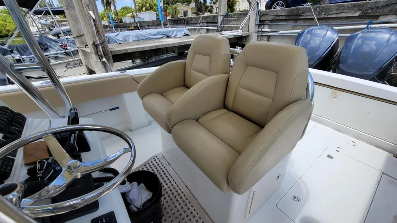 Every Effort Yacht Photos Pics 2008 Jupiter 34 FS boat with dual beige captain's chairs and steering wheel.