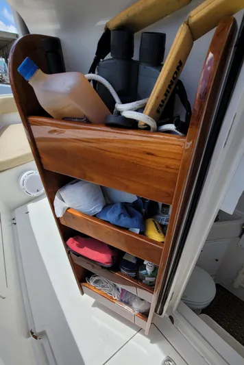 Every Effort Yacht Photos Pics Wooden storage shelves on a 2008 Jupiter 34 FS boat.