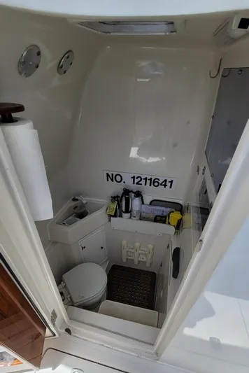 Every Effort Yacht Photos Pics Interior of 2008 Jupiter 34 FS boat with toilet and storage area.