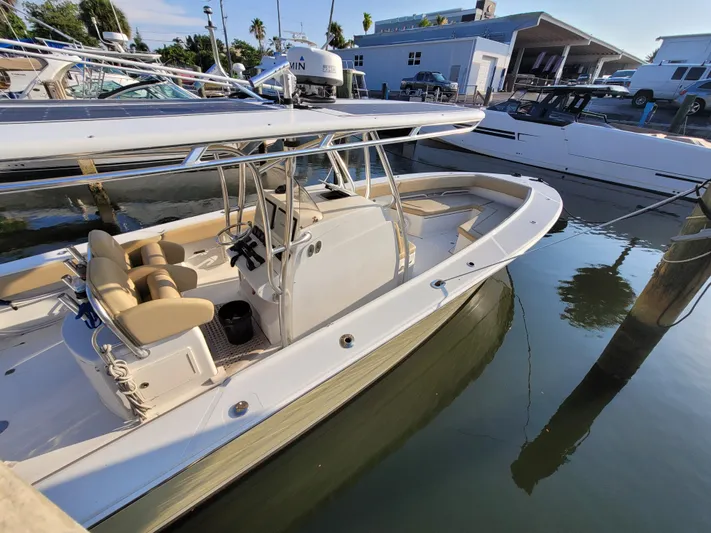 Every Effort Yacht Photos Pics 2008 Jupiter 34 FS boat docked at a marina, featuring a spacious deck and seating area.