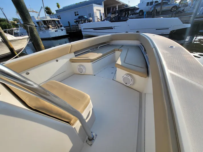 Every Effort Yacht Photos Pics 2008 Jupiter 34 FS boat interior with beige seating and white deck.