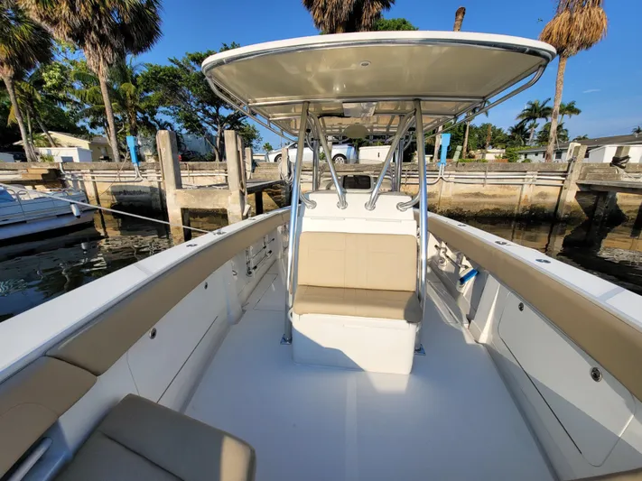 Every Effort Yacht Photos Pics 2008 Jupiter 34 FS boat docked, featuring spacious seating and a T-top canopy.