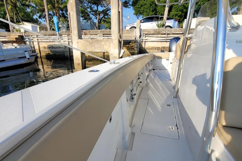 Every Effort Yacht Photos Pics 2008 Jupiter 34 FS boat docked at marina, side view of deck and seating area.