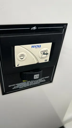  Yacht Photos Pics Monterey 385 SE 2021 control panel with Thetford Tecma flush and add water buttons.