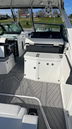  Yacht Photos Pics 2021 Monterey 385 SE boat interior with modern seating and sleek design.