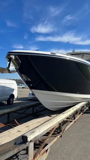  Yacht Photos Pics 2021 Monterey 385 SE boat on trailer under clear blue sky.