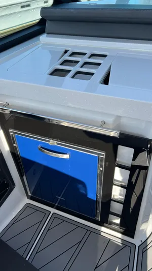  Yacht Photos Pics 2021 Monterey 385 SE boat interior with sleek countertop and storage compartment.