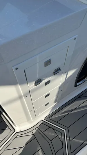  Yacht Photos Pics 2021 Monterey 385 SE boat interior with storage compartments and sleek flooring design.