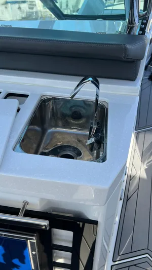  Yacht Photos Pics Stainless steel sink on 2021 Monterey 385 SE boat deck.