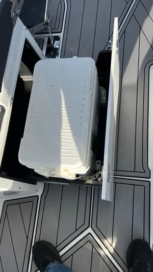  Yacht Photos Pics 2021 Monterey 385 SE boat deck with storage compartment open.