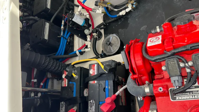  Yacht Photos Pics Engine compartment of a 2021 Monterey 385 SE boat with batteries and wiring.