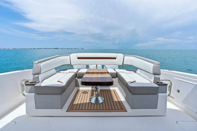  Yacht Photos Pics Luxurious seating area on 2023 Tiara Yachts 38 LS, overlooking serene ocean view.
