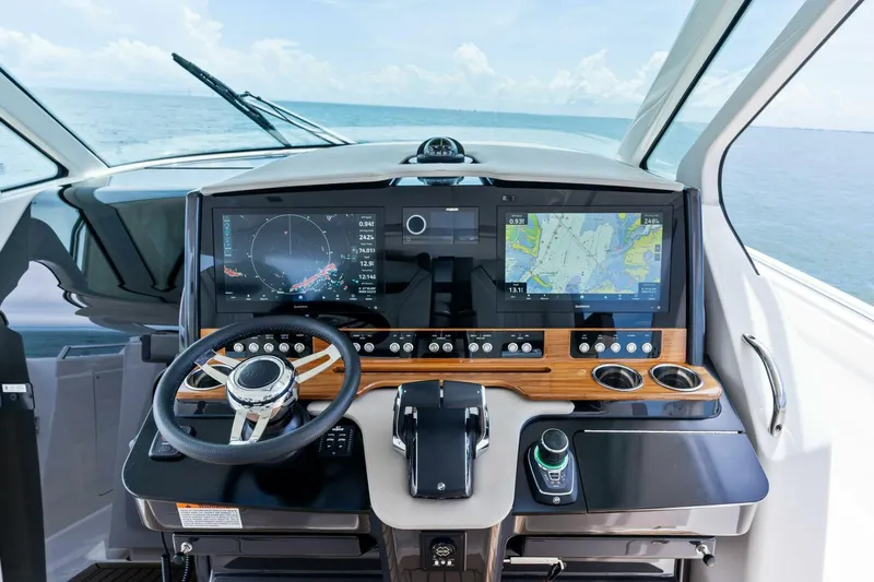  Yacht Photos Pics 2023 Tiara Yachts 38 LS helm with advanced navigation displays and controls.