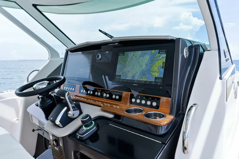  Yacht Photos Pics 2023 Tiara Yachts 38 LS helm with advanced navigation system and sleek design.