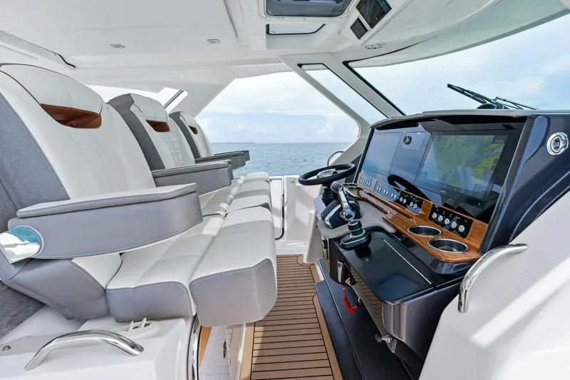  Yacht Photos Pics 2023 Tiara Yachts 38 LS interior with luxurious seating and advanced navigation system.