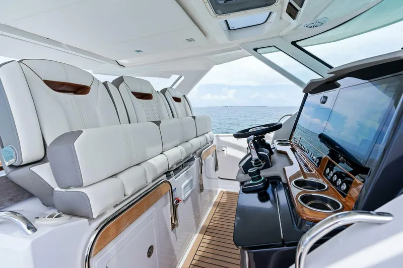  Yacht Photos Pics 2023 Tiara Yachts 38 LS interior with luxurious seating and modern helm controls.