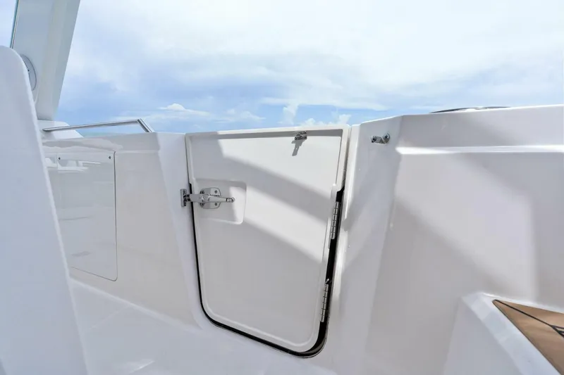  Yacht Photos Pics 2023 Tiara Yachts 38 LS boat door with sleek white finish and secure latch.