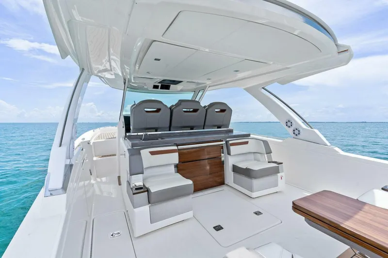  Yacht Photos Pics 2023 Tiara Yachts 38 LS luxury boat interior with seating, ocean view.