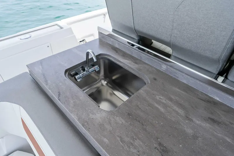  Yacht Photos Pics Luxury yacht sink on 2023 Tiara Yachts 38 LS, featuring sleek countertop design.