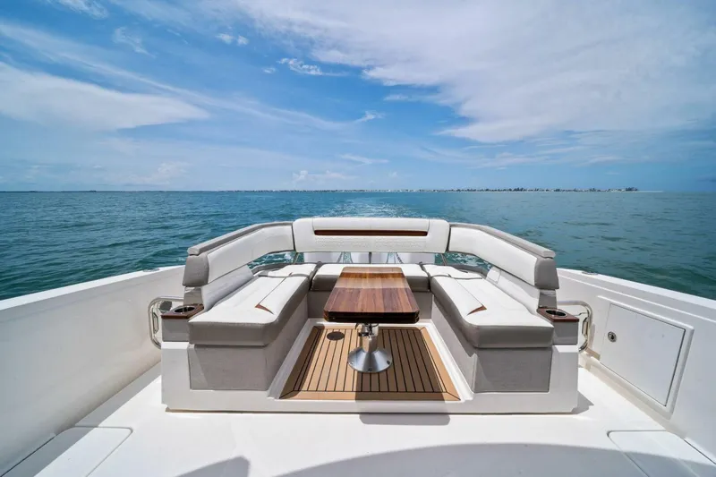  Yacht Photos Pics 2023 Tiara Yachts 38 LS luxury boat with elegant seating and ocean view.