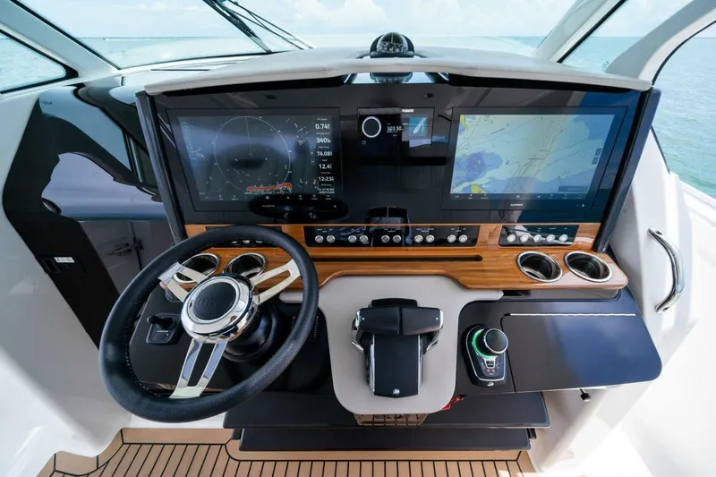  Yacht Photos Pics 2023 Tiara Yachts 38 LS helm with advanced navigation displays and controls.