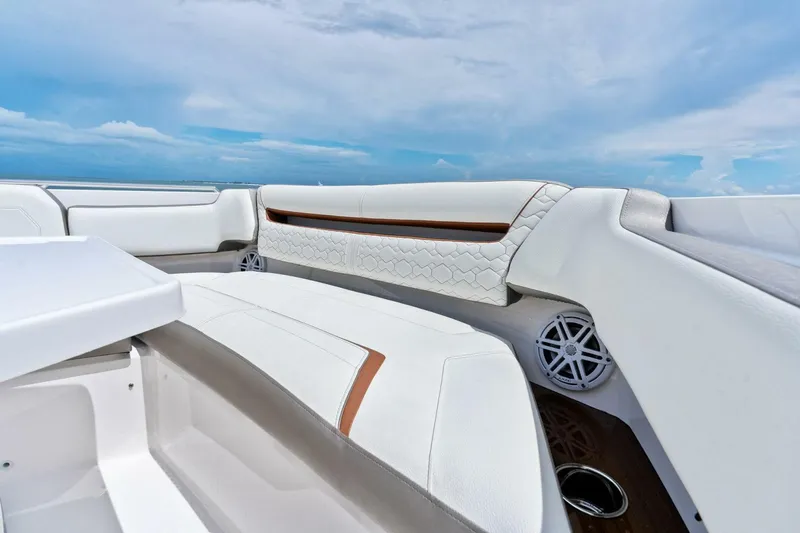  Yacht Photos Pics 2023 Tiara Yachts 38 LS interior with luxurious white seating and ocean view.