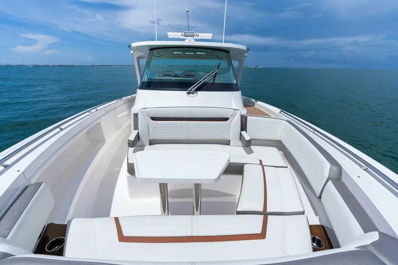  Yacht Photos Pics 2023 Tiara Yachts 38 LS with luxurious seating on open water.