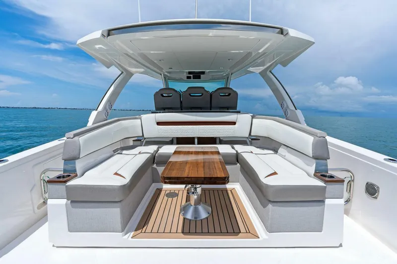  Yacht Photos Pics 2023 Tiara Yachts 38 LS luxury boat interior with seating and table, ocean view.