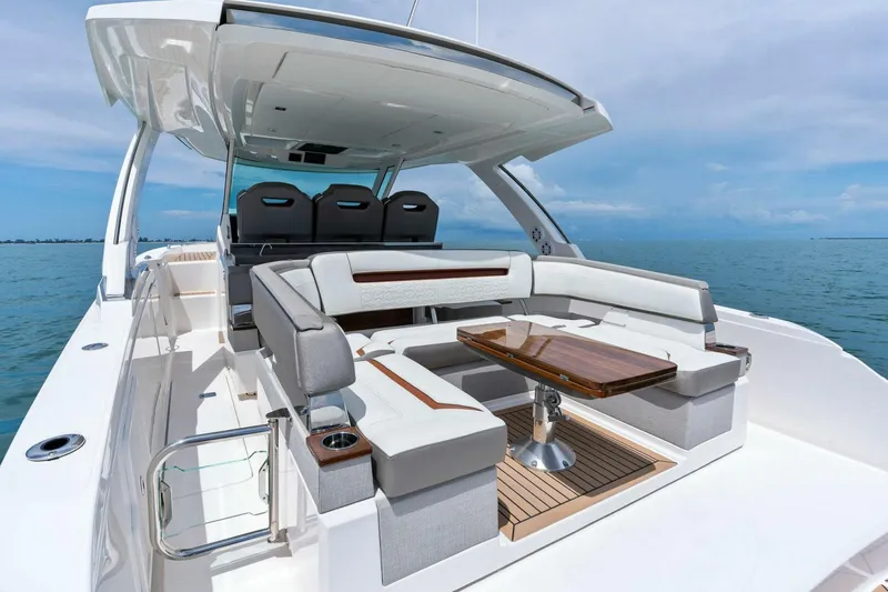  Yacht Photos Pics 2023 Tiara Yachts 38 LS luxury boat with elegant seating and ocean view.