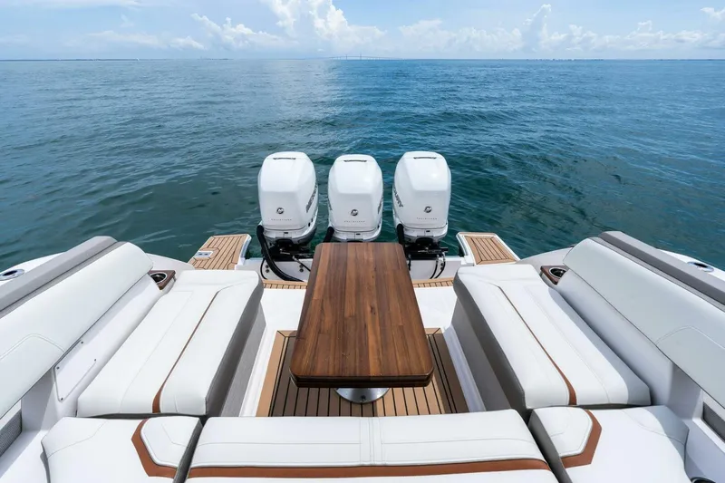 Yacht Photos Pics 2023 Tiara Yachts 38 LS with triple engines, luxurious seating, and ocean view.