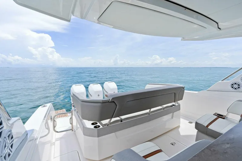  Yacht Photos Pics 2023 Tiara Yachts 38 LS luxury boat with ocean view and modern seating.
