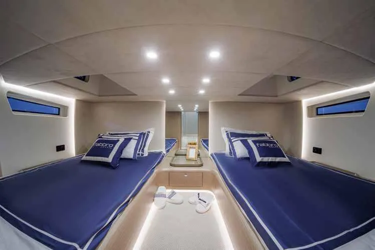 Therapy 1 Yacht Photos Pics Luxurious 2024 Fabbro F45 yacht cabin with twin beds and modern lighting.