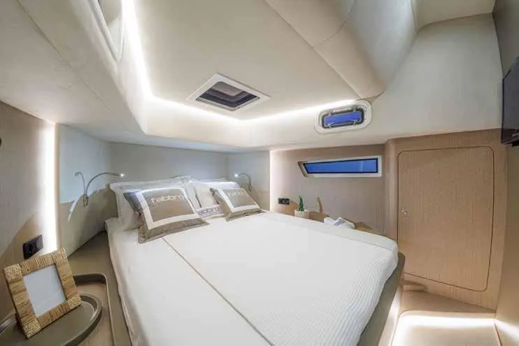 Therapy 1 Yacht Photos Pics Luxurious cabin interior of 2024 Fabbro F45 yacht with modern design and ambient lighting.