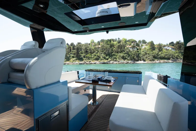 Therapy 1 Yacht Photos Pics Luxurious 2024 Fabbro F45 yacht interior with plush seating and scenic water view.