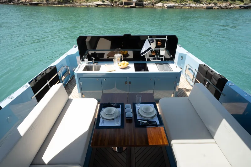 Therapy 1 Yacht Photos Pics Luxury Fabbro F45 yacht deck with dining area and kitchenette, 2024 model.