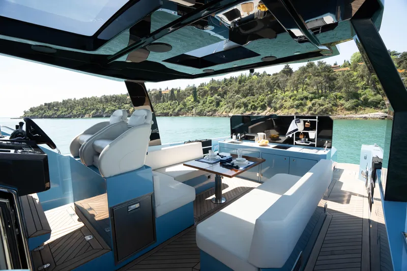 Therapy 1 Yacht Photos Pics Luxurious 2024 Fabbro F45 yacht interior with modern seating and scenic water view.