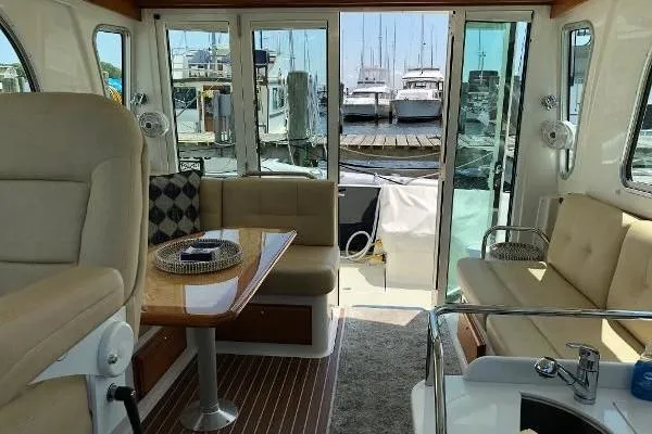  Yacht Photos Pics Interior of 2018 Back Cove Downeast 37 yacht with seating and marina view.