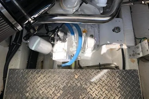  Yacht Photos Pics Engine compartment of 2018 Back Cove Downeast 37 with visible components and metal flooring.