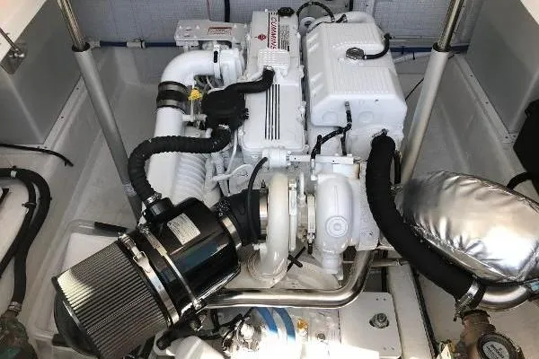  Yacht Photos Pics 2018 Back Cove Downeast 37 engine compartment with detailed view of the engine components.